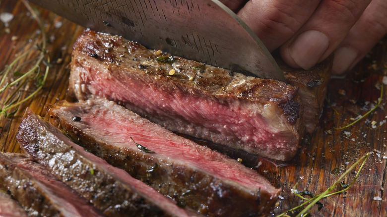 steak being cut