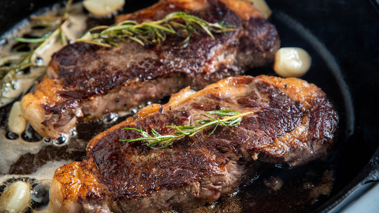 Grilled steak with charred exterior 