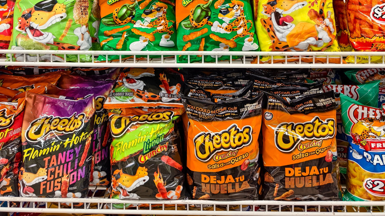 Various Cheetos flavors on a shelf