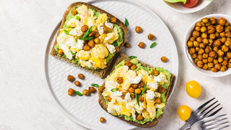 Eggs and chickpeas on avocado toast