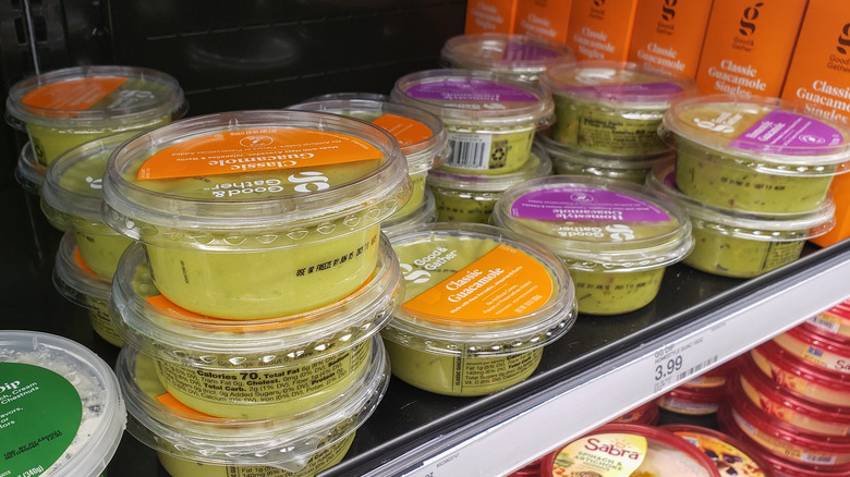 tubs of store-bought guacamole