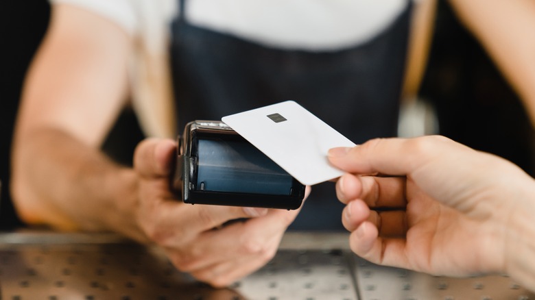 Person paying with credit card