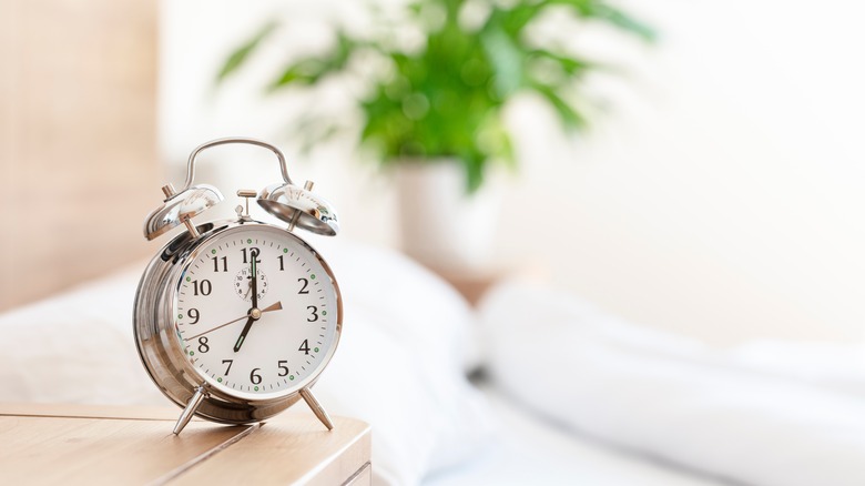 alarm clock on bedside table