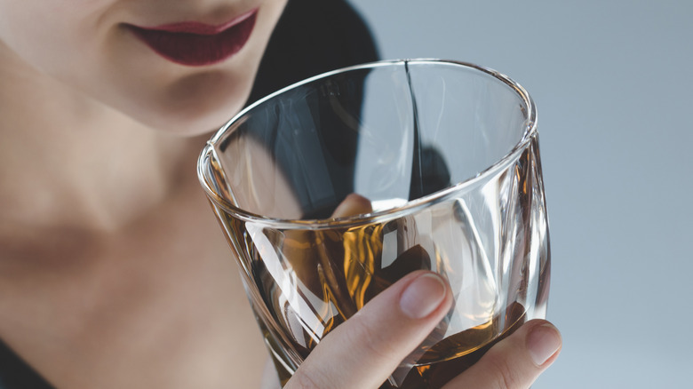 Woman drinking whiskey 