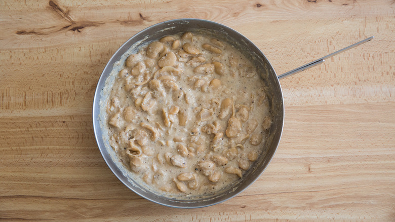 creamy butter beans in pan