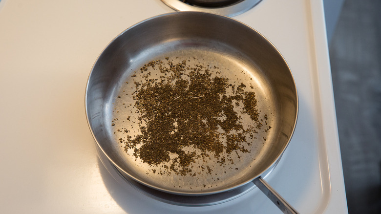 black pepper toasting in pan