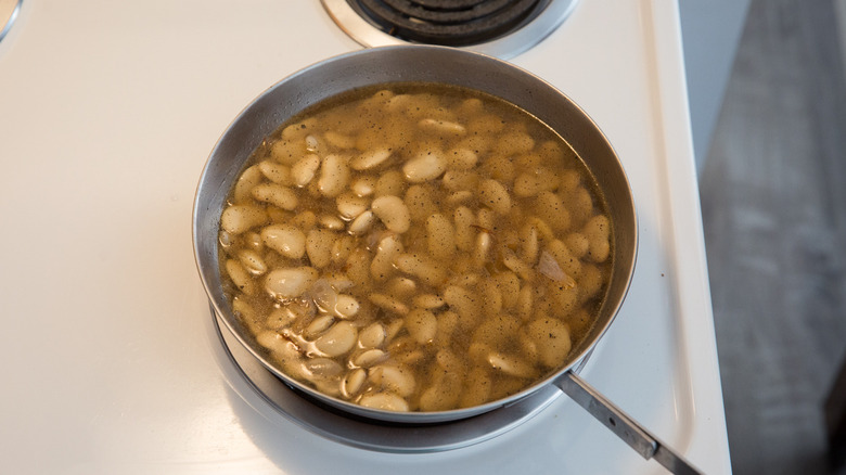 beans cooking in metal pan