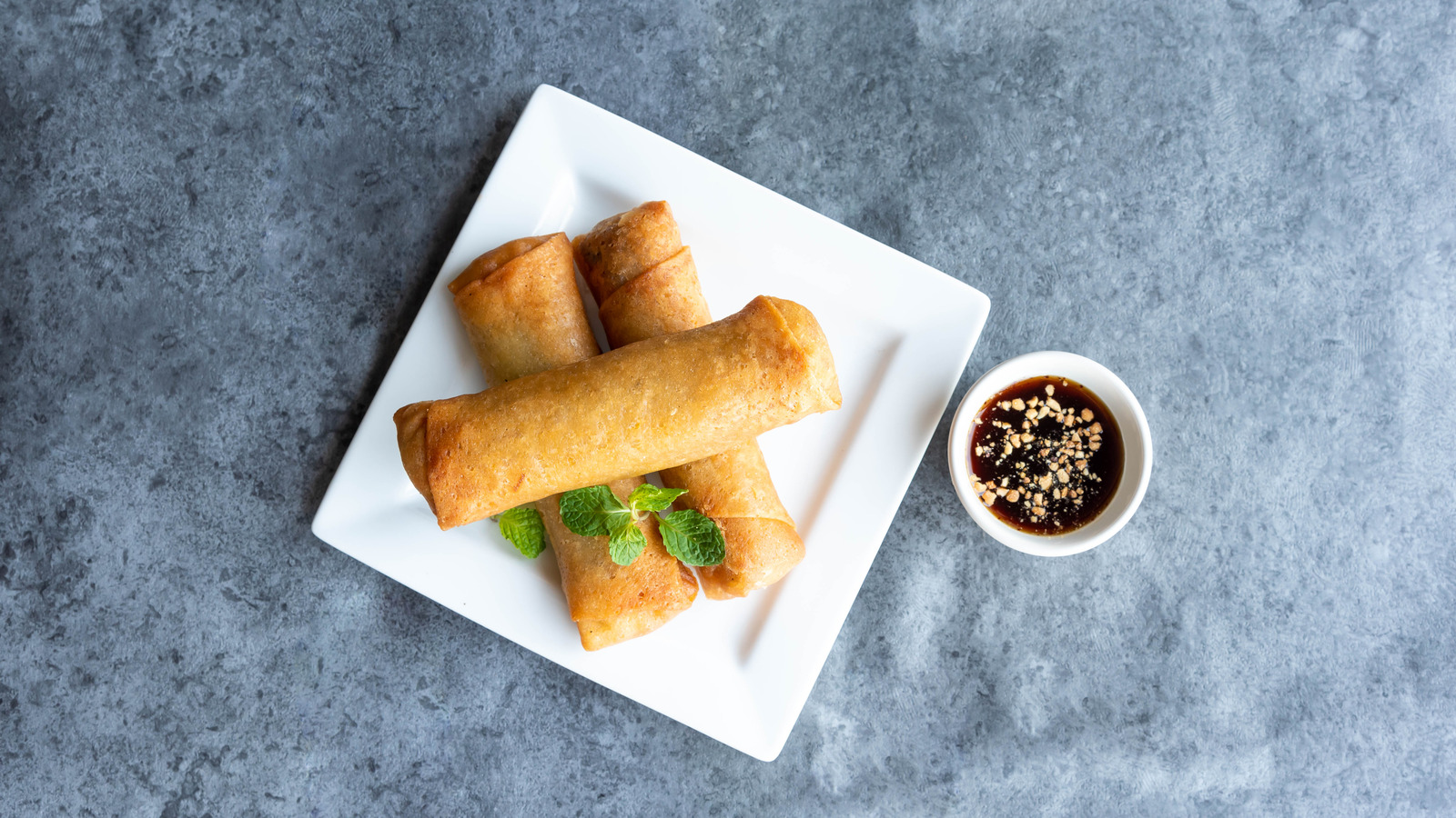 https://www.tastingtable.com/img/gallery/in-detroit-these-egg-rolls-are-stuffed-with-corned-beef/l-intro-1684444073.jpg