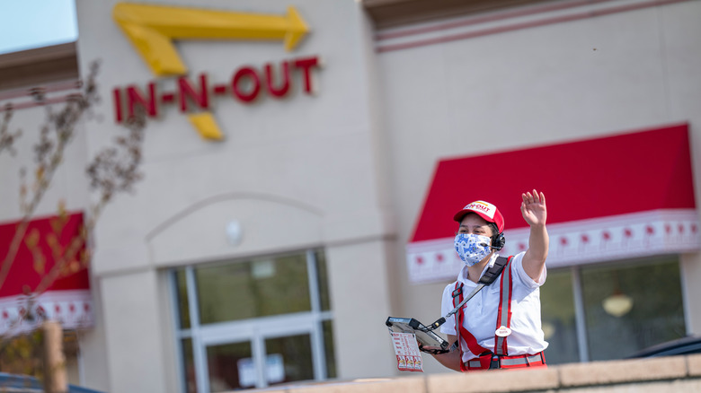 In-N-Out Burger masked associate waving