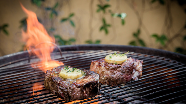 Steaks cooking on grill