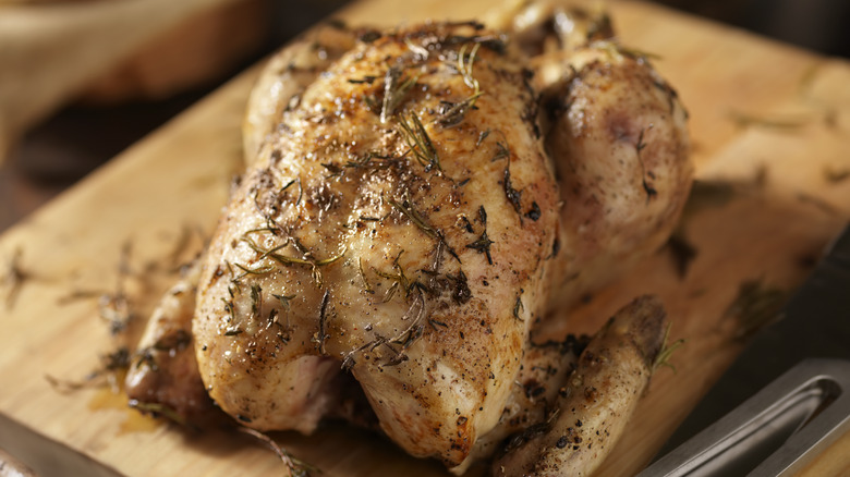 Roast chicken on wooden board