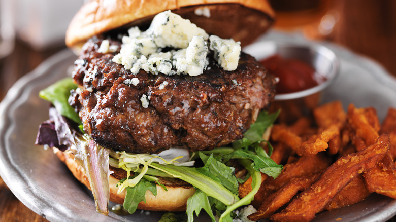 Juicy blue cheese burger and sweet potato fries