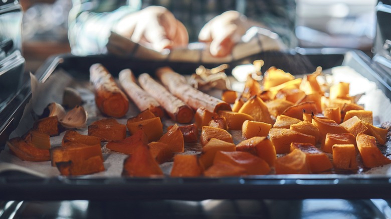 Sheet pan of vegetables in oven