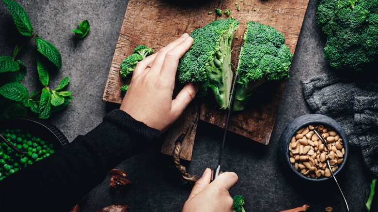 Person chopping broccoli