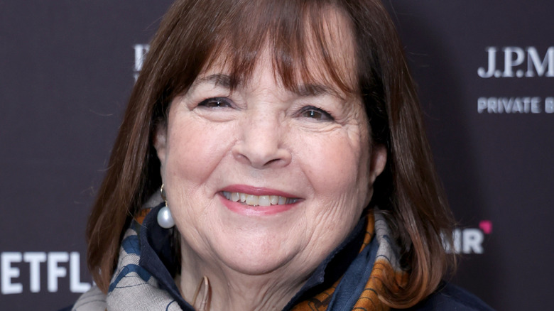 Ina Garten smiling with grey, orange, and blue scarf