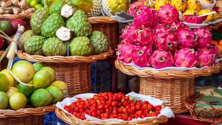 Unique fruits and vegetables in wicker baskets at a market
