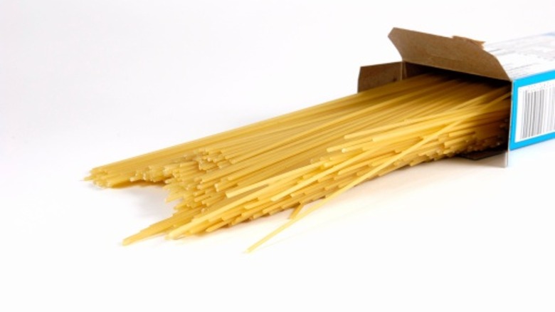 dried spaghetti spilling out of box