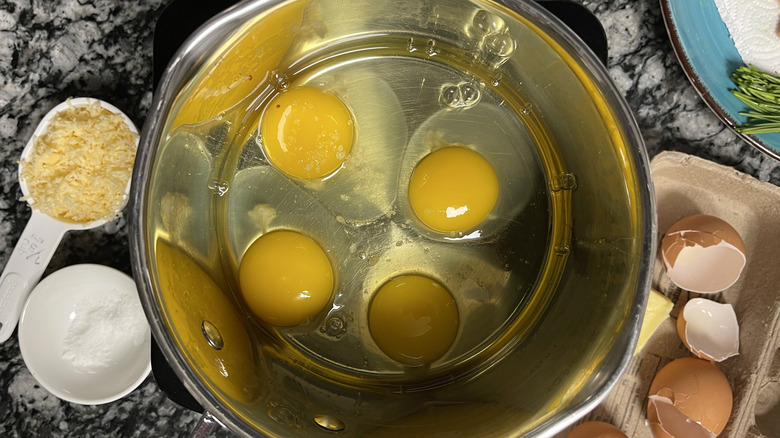 four eggs in saucepan