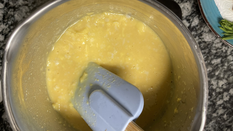 stirring egg mixture in saucepan