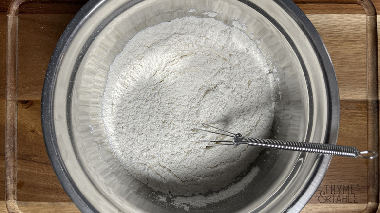 whisking flour in bowl