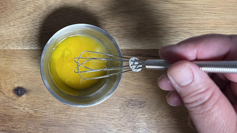 whisking truffle oil egg wash