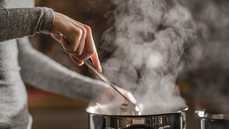 a woman stirring a pot