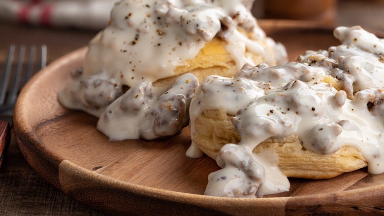 creamy sausage gravy on two biscuits