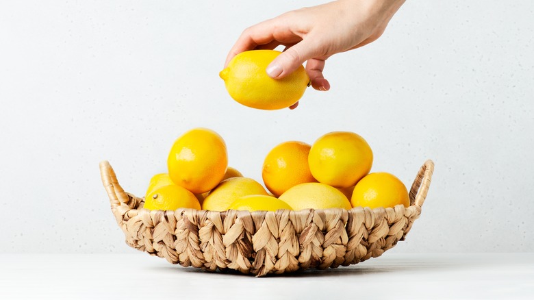 hand grabbing a lemon