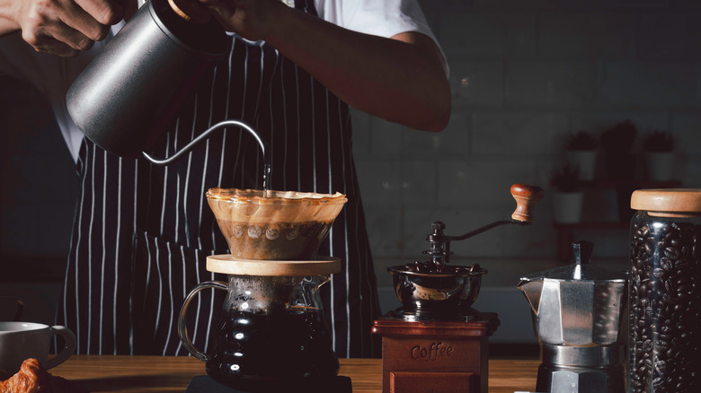 barista making coffee pour-over