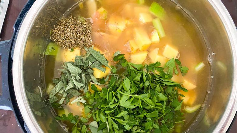 vegetables and herbs in pot