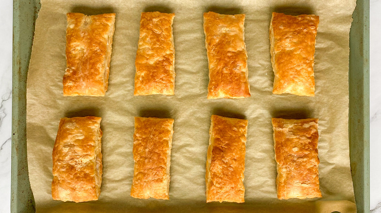 puff pastry squares on baking sheet