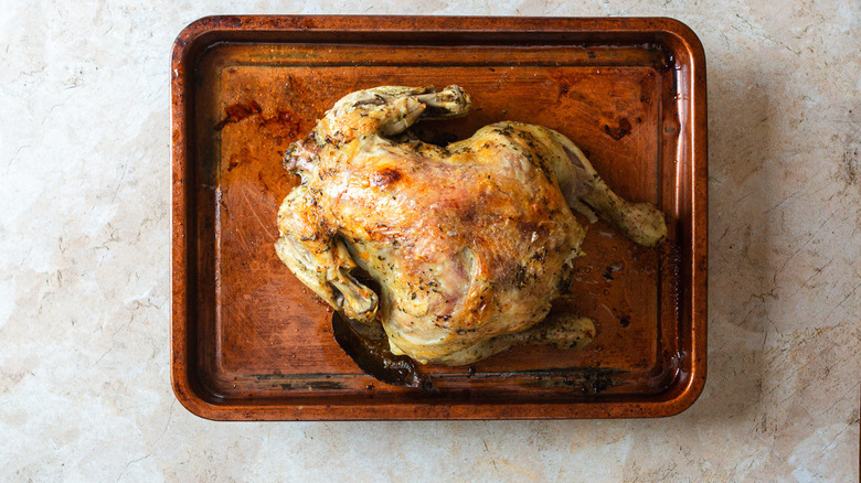 Broiled chicken on baking dish