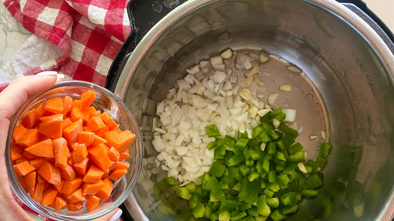 adding carrots to pot