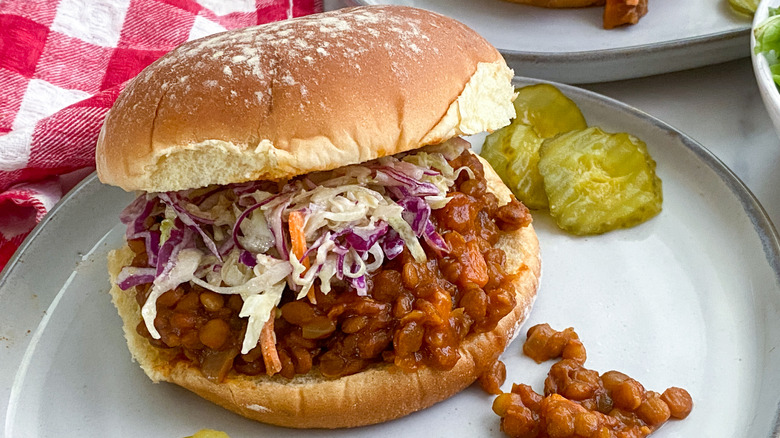 Plated lentil sloppy Joe's on bun with coleslaw