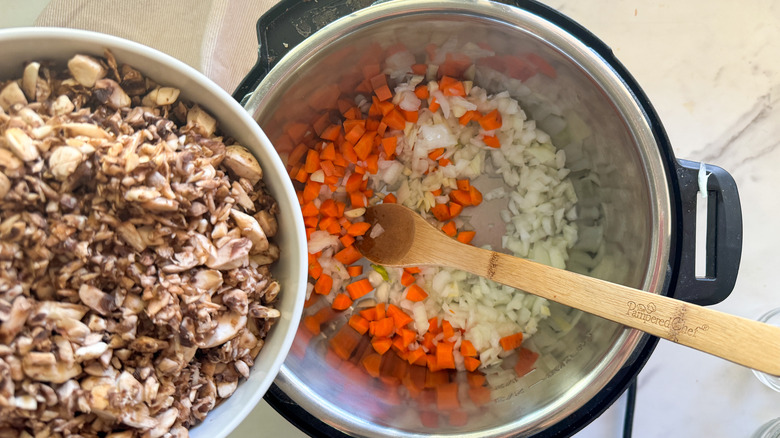 adding mushrooms to pot