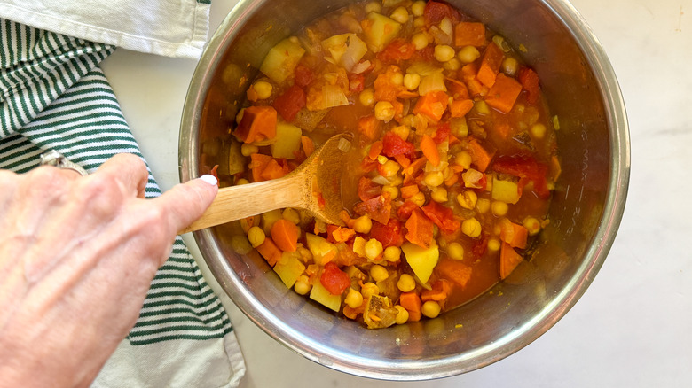 stirring tagine in pot