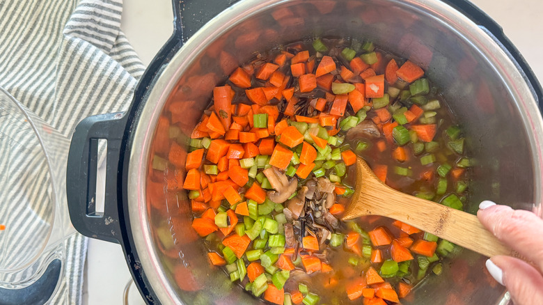 wooden spoon stirring the soup