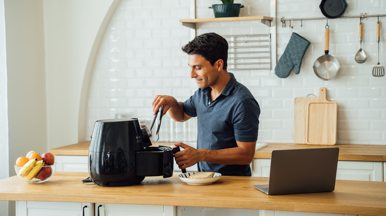 man with air fryer