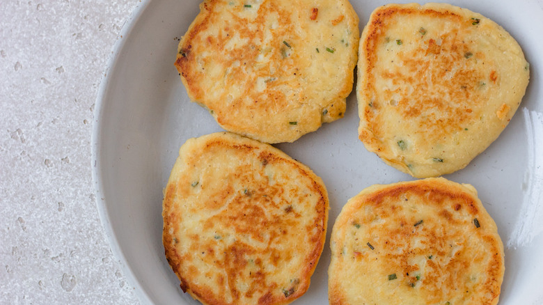 fried potato cakes in pan