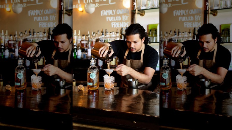 Bartender mixing cocktail