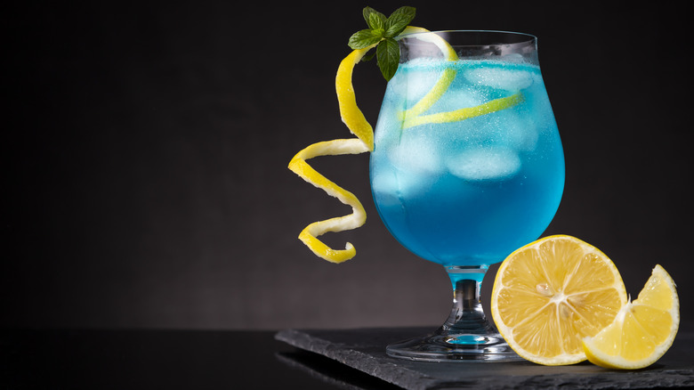 Blue Lagoon cocktail against a black background