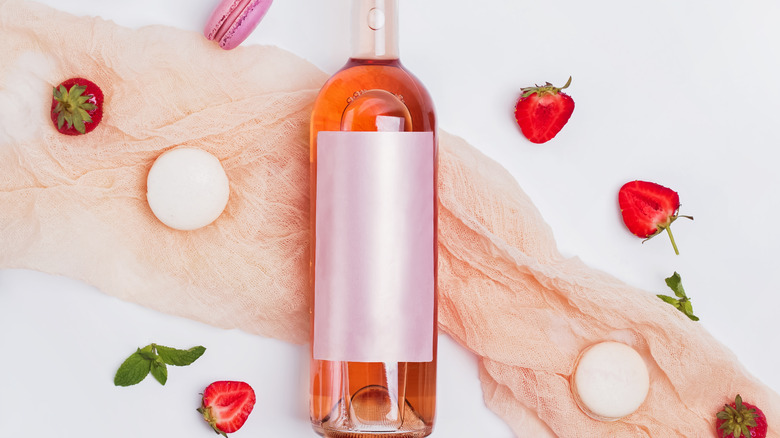 bottle of rose and macaroons