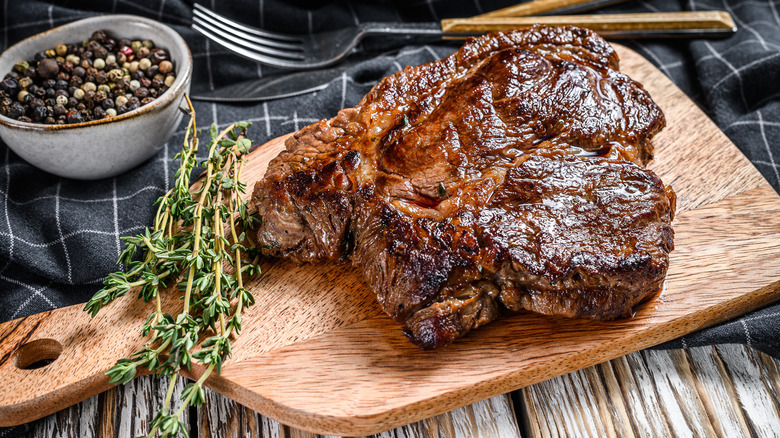 Grilled chuck steak on cutting board