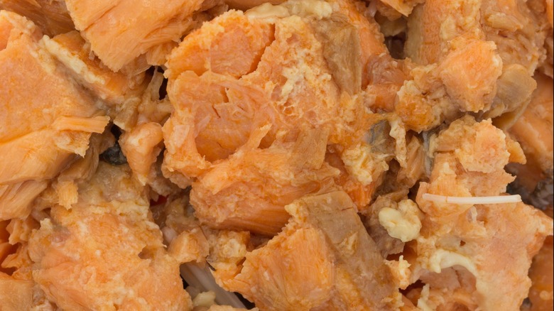 Close-up of canned salmon chunks with bones