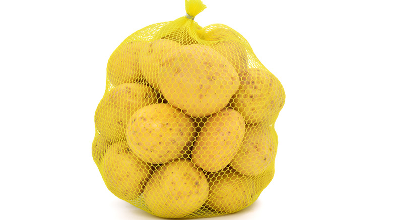 Potatoes in a yellow mesh bag 