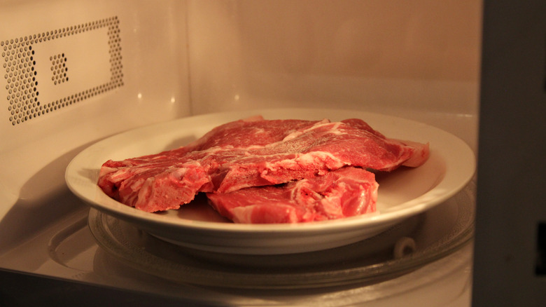 raw steak in microwave.