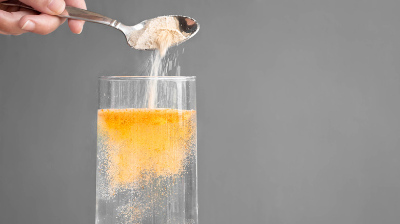 Adding orange powder to water