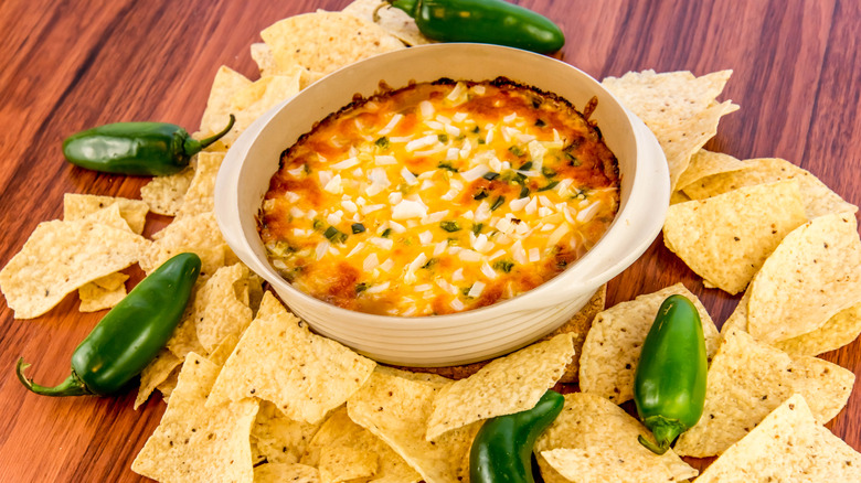 Seven-layer dip with chips and jalapenos