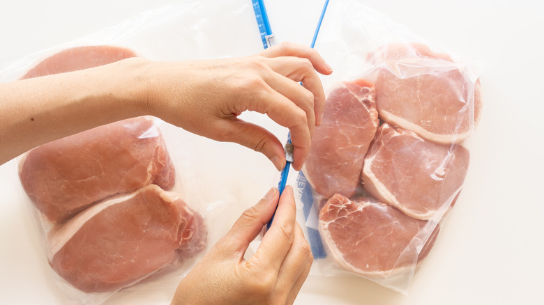 sealing bags of pork chops