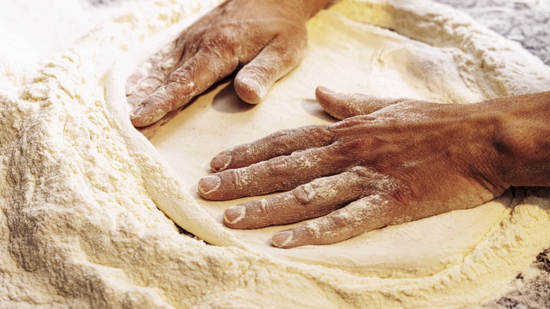 forming pizza dough by hand